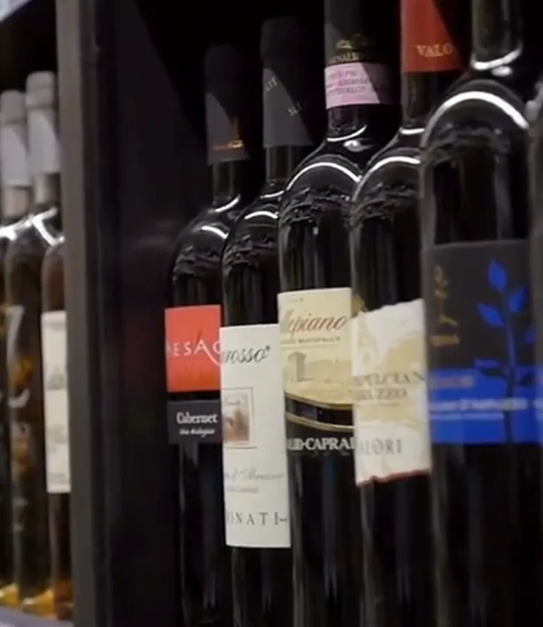 Inside the shop, along the wine shelf